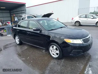 2010 Kia Optima LX with VIN KNAGG4A85A5375227, listed as a IAAI auction lot 42019118 with 221,324 mi miles. Bid and sale history available at carsss.com. Image 1.