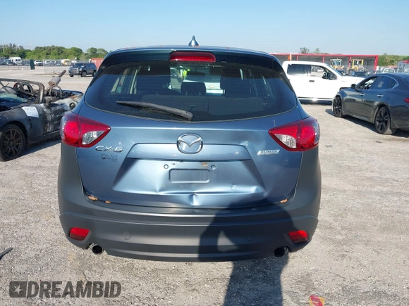2016 Mazda CX-5 Sport with VIN JM3KE2BY8G0864983, listed as a IAAI auction lot 42072385 with 141,104 mi miles. Bid and sale history available at carsss.com. Image 16.
