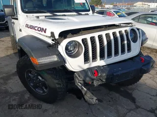 2023 Jeep Gladiator Rubicon z VIN 1C6JJTBG5PL566958, wystawiony jako IAAI lot #42298811 z przebiegiem 18 568 mil mil oraz . Historia ofert i sprzedaży dostępna na DreamBid. Obrazek 6.