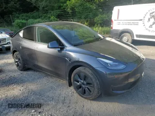 2024 Tesla Model Y Long Range with VIN 7SAYGDEE4RA299503, listed as a Copart auction lot 61950585 with 17,077 mi miles and Salvage title. Bid and sale history available at DreamBid. Image 4.