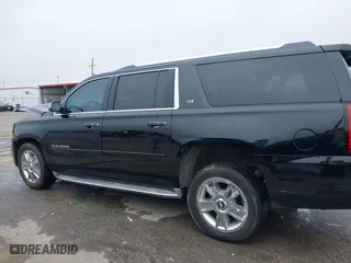 2015 Chevrolet Suburban LTZ with VIN 1GNSCKKC6FR271675, listed as a IAAI auction lot 41915036 with 150,917 mi miles. Bid and sale history available at carsss.com. Image 14.