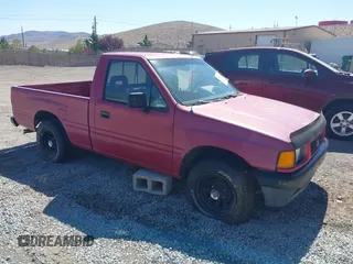 1992 Isuzu Pickup S z VIN 4S1CL11L1N4220825, wystawiony jako IAAI lot #42413712 z przebiegiem 184 343 mil mil oraz . Historia ofert i sprzedaży dostępna na DreamBid. Obrazek 1.