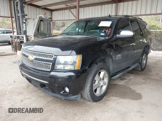 2013 Chevrolet Tahoe LS with VIN 1GNSCAE01DR121580, listed as a IAAI auction lot 41714743 with 257,616 mi miles and . Bid and sale history available at DreamBid. Image 2.