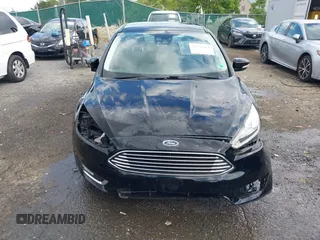 2016 Ford Focus Titanium z VIN 1FADP3J27GL215436, wystawiony jako IAAI lot #42709166 z przebiegiem 75 956 mil mil oraz . Historia ofert i sprzedaży dostępna na DreamBid. Obrazek 13.