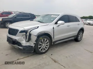2021 Cadillac XT4 FWD Premium Luxury z VIN 1GYFZCR42MF004233, wystawiony jako Copart lot #57229385 z przebiegiem 98 387 mil mil oraz Szkody całkowita. Historia ofert i sprzedaży dostępna na DreamBid. Obrazek 1.