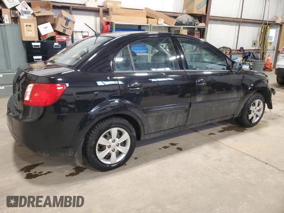 2010 Kia Rio with VIN KNADH4B37A6641845, listed as a Copart auction lot 51861215 with 163,894 mi miles and Salvage Title. Bid and sale history available at DreamBid. Image 3.