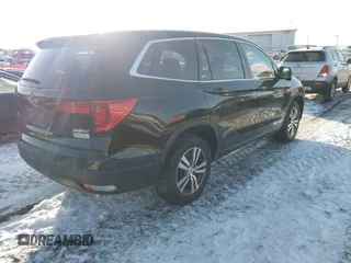 2016 Honda Pilot EX-L with VIN 5FNYF6H7XGB115951, listed as a IAAI auction lot 41642756 with 101,688 mi miles. Bid and sale history available at carsss.com. Image 4.