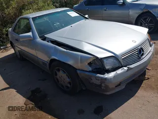 1994 Mercedes-Benz SL 5.0L z VIN WDBFA67E7RF099016, wystawiony jako IAAI lot #42408198 z przebiegiem 174 574 mil mil oraz . Historia ofert i sprzedaży dostępna na DreamBid. Obrazek 1.