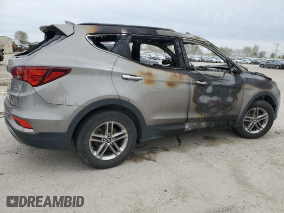 2017 Hyundai Santa Fe 2.4L z VIN 5NMZUDLB0HH042101, wystawiony jako Copart lot #55058145 z przebiegiem Nie podano mil oraz Szkoda całkowita • Salvage title. Historia ofert i sprzedaży dostępna na DreamBid. Obrazek 3.