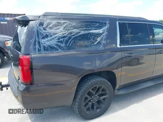 2015 Chevrolet Suburban LT z VIN 1GNSKJKC9FR245097, wystawiony jako IAAI lot #42468168 z przebiegiem 198 454 mil mil oraz . Historia ofert i sprzedaży dostępna na DreamBid. Obrazek 6.
