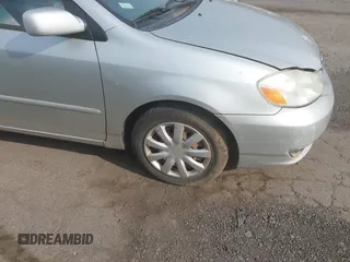 2003 Toyota Corolla CE with VIN JTDBR32E930004139, listed as a IAAI auction lot 42113619 with 209,120 mi miles. Bid and sale history available at carsss.com. Image 14.