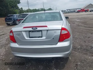2012 Ford Fusion SE z VIN 3FAHP0HA3CR421636, wystawiony jako IAAI lot #42454385 z przebiegiem 138 282 mil mil oraz . Historia ofert i sprzedaży dostępna na DreamBid. Obrazek 16.
