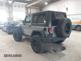 2014 Jeep Wrangler Sport with VIN 1C4AJWAG0EL173362, listed as a IAAI auction lot 42231863 with 99,321 mi miles and . Bid and sale history available at DreamBid. Image 3.