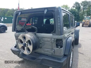 2020 Jeep Wrangler Unlimited Black and Tan with VIN 1C4HJXDG3LW298223, listed as a IAAI auction lot 42446032 with 17,688 mi miles and . Bid and sale history available at DreamBid. Image 4.