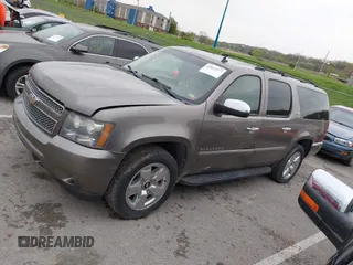 2011 Chevrolet Suburban LTZ with VIN 1GNSKKE32BR197356, listed as a IAAI auction lot 42052377 with 248,574 mi miles and . Bid and sale history available at DreamBid. Image 14.