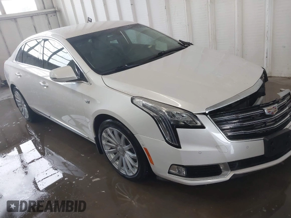 2018 Cadillac XTS Luxury z VIN 2G61M5S38J9156679, wystawiony jako IAAI lot #41574733 z przebiegiem 65 637 mil mil oraz . Historia ofert i sprzedaży dostępna na DreamBid. Obrazek 1.