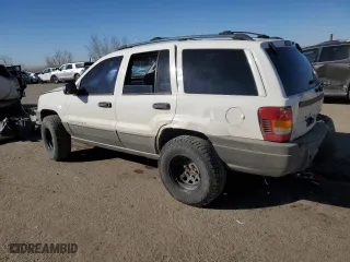 2002 Jeep Grand Cherokee Laredo with VIN 1J4GW48S72C298133, listed as a Copart auction lot 43973315 with 266,437 mi miles and Salvage Title. Bid and sale history available at carsss.com. Image 2.