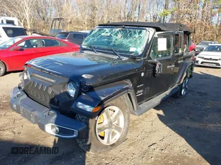 2021 Jeep Wrangler Unlimited Sahara with VIN 1C4HJXEN4MW714133, listed as a IAAI auction lot 41241040 with 82,247 mi miles and . Bid and sale history available at DreamBid. Image 2.