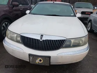 2001 Lincoln Continental with VIN 1LNHM97V51Y670610, listed as a IAAI auction lot 41439804 with 160,114 mi miles. Bid and sale history available at carsss.com. Image 6.