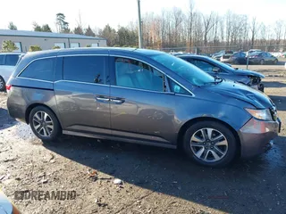 2014 Honda Odyssey Touring with VIN 5FNRL5H94EB081267, listed as a IAAI auction lot 41199509 with 146,827 mi miles and . Bid and sale history available at DreamBid. Image 13.