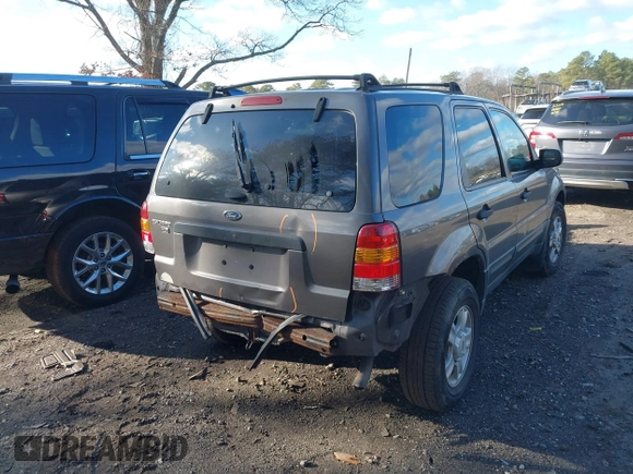 2003 Ford Escape XLT Popular 2 with VIN 1FMYU931X3KC87514, listed as a IAAI auction lot 41222513 with 267,880 mi miles. Bid and sale history available at carsss.com. Image 6.