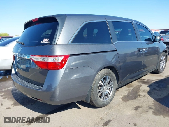2012 Honda Odyssey EX-L with VIN 5FNRL5H64CB044075, listed as a IAAI auction lot 42094680 with 67,165 mi miles and . Bid and sale history available at carsss.com. Image 4.