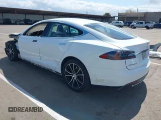 2014 Tesla Model S 60 with VIN 5YJSA1H10EFP56526, listed as a IAAI auction lot 41871784 with 143,361 mi miles and . Bid and sale history available at DreamBid. Image 3.