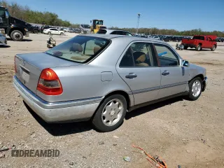 1995 Mercedes-Benz C with VIN WDBHA28E7SF255142, listed as a Copart auction lot 68411704 with 334,000 mi miles and Salvage Title. Bid and sale history available at carsss.com. Image 3.
