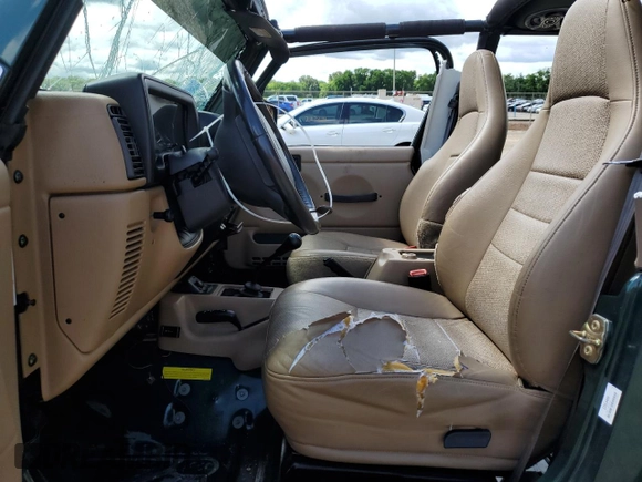 1999 Jeep Wrangler Sport with VIN 1J4FY19S0XP402688, listed as a Copart auction lot 58968125 with 211,910 mi miles and Salvage title. Bid and sale history available at DreamBid. Image 7.
