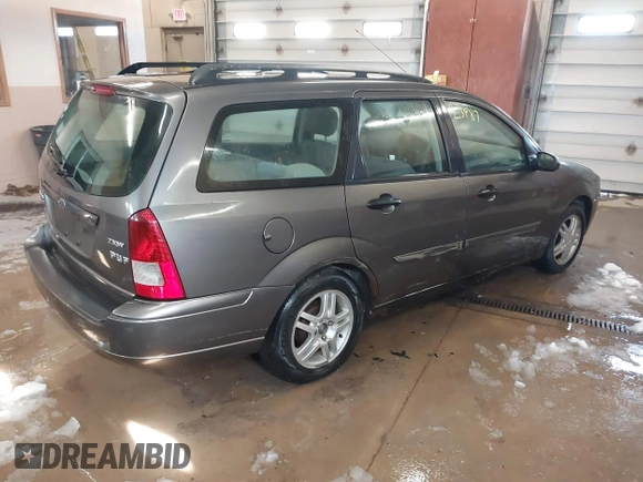 2005 Ford Focus SE with VIN 1FAFP36N45W158796, listed as a IAAI auction lot 41823987 with 145,803 mi miles and . Bid and sale history available at carsss.com. Image 4.