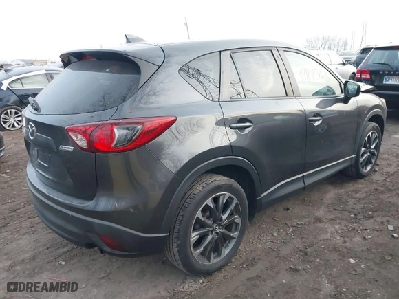 2016 Mazda CX-5 Grand Touring with VIN JM3KE4DYXG0684638, listed as a IAAI auction lot 41101563 with NaN miles. Bid and sale history available at carsss.com. Image 4.