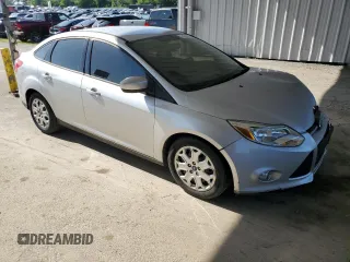 2012 Ford Focus SE with VIN 1FAHP3F29CL161559, listed as a Copart auction lot 61695575 with 127,412 mi miles and Salvage title. Bid and sale history available at DreamBid. Image 4.