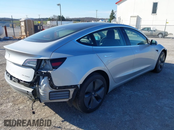 2018 Tesla Model 3 Long Range Battery with VIN 5YJ3E1EB9JF065057, listed as a IAAI auction lot 41863903 with 54,584 mi miles and . Bid and sale history available at DreamBid. Image 4.