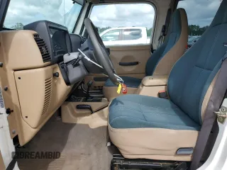 1999 Jeep Wrangler Sahara z VIN 1J4FY49S0XP432968, wystawiony jako Copart lot #65033715 z przebiegiem 126 420 mil mil oraz Szkoda całkowita • Salvage title. Historia ofert i sprzedaży dostępna na DreamBid. Obrazek 7.
