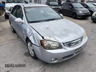 2004 Kia Spectra LX with VIN KNAFE121845043143, listed as a IAAI auction lot 41574523 with 211,758 mi miles. Bid and sale history available at carsss.com. Image 1.