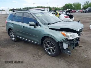 2015 Subaru Forester Touring z VIN JF2SJAWC9FH561581, wystawiony jako IAAI lot #42237512 z przebiegiem 109 210 mil mil oraz . Historia ofert i sprzedaży dostępna na DreamBid. Obrazek 1.