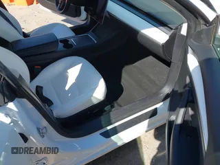 2022 Tesla Model 3 with VIN 5YJ3E1EA7NF103513, listed as a IAAI auction lot 41643592 with 35,631 mi miles and . Bid and sale history available at DreamBid. Image 5.