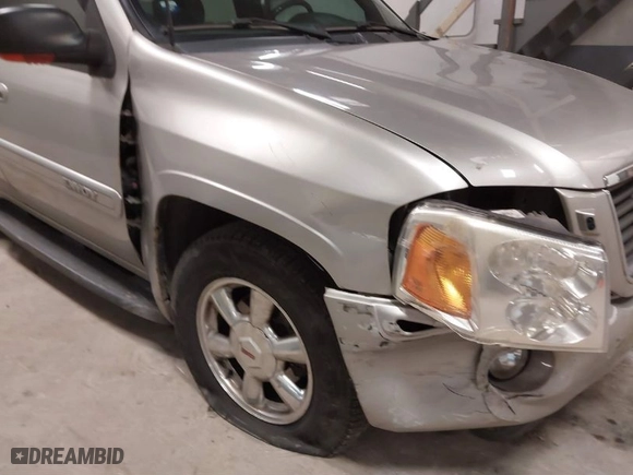 2004 GMC Envoy SLE with VIN 1GKDT13S842217581, listed as a IAAI auction lot 41445234 with 170,310 mi miles. Bid and sale history available at carsss.com. Image 6.