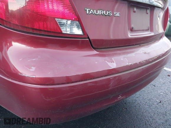 2002 Ford Taurus SE Standard z VIN 1FAFP53U32G242170, wystawiony jako IAAI lot #41299039 z przebiegiem 99 928 mil mil oraz . Historia ofert i sprzedaży dostępna na DreamBid. Obrazek 13.