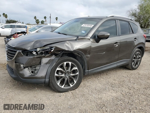 2016 Mazda CX-5 Grand Touring z VIN JM3KE2DY7G0735355, wystawiony jako Copart lot #49438285 z przebiegiem 132 731 mil mil oraz Szkoda całkowita • Salvage title. Historia ofert i sprzedaży dostępna na DreamBid. Obrazek 1.