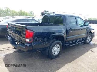 2022 Toyota Tacoma SR with VIN 3TYCZ5AN0NT074683, listed as a IAAI auction lot 42117875 with 51,112 mi miles and . Bid and sale history available at DreamBid. Image 4.