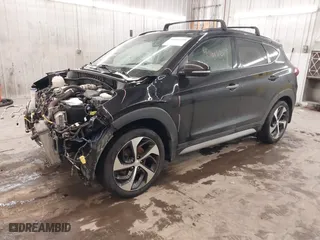 2018 Hyundai Tucson Value with VIN KM8J3CA28JU648236, listed as a IAAI auction lot 41161221 with 104,057 mi miles. Bid and sale history available at carsss.com. Image 2.
