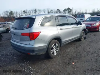 2018 Honda Pilot EX-L with VIN 5FNYF6H59JB026068, listed as a IAAI auction lot 41458049 with 128,769 mi miles. Bid and sale history available at carsss.com. Image 4.