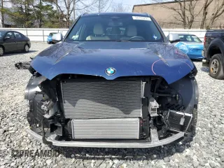 2023 BMW X1 xDrive28i with VIN WBX73EF05P5Y21721, listed as a Copart auction lot 50749295 with 10,633 mi miles and Salvage title. Bid and sale history available at DreamBid. Image 5.