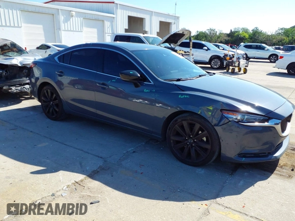 2021 Mazda 6 Carbon Edition with VIN JM1GL1WY4M1619533, listed as a IAAI auction lot 41979213 with 84,783 mi miles and . Bid and sale history available at DreamBid. Image 1.