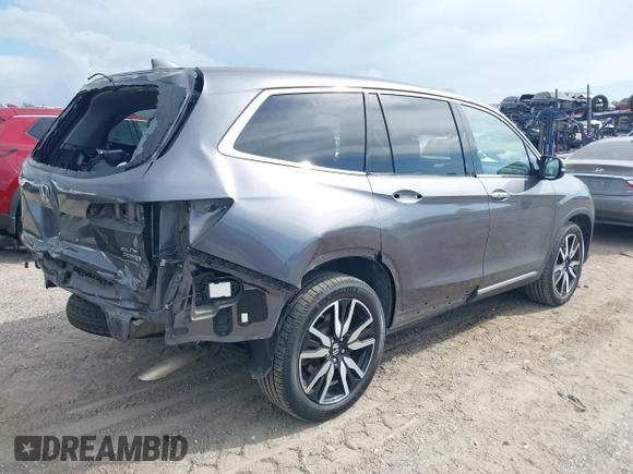 2022 Honda Pilot Elite with VIN 5FNYF6H04NB025212, listed as a IAAI auction lot 42430032 with 69,427 mi miles and . Bid and sale history available at DreamBid. Image 4.