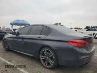 2019 BMW 5 Series M550i xDrive with VIN WBAJB9C59KB287501, listed as a Copart auction lot 59732425 with 74,345 mi miles and Salvage title. Bid and sale history available at DreamBid. Image 2.