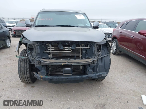 2015 Infiniti QX80 with VIN JN8AZ2NF1F9571315, listed as a IAAI auction lot 41522434 with 166,947 mi miles. Bid and sale history available at carsss.com. Image 12.