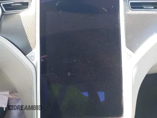 2014 Tesla Model S 60 z VIN 5YJSA1H17EFP33910, wystawiony jako IAAI lot #42346934 z przebiegiem Nie podano mil oraz . Historia ofert i sprzedaży dostępna na DreamBid. Obrazek 7.