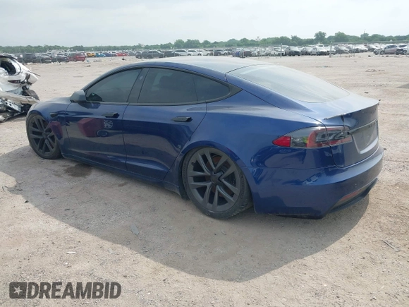 2021 Tesla Model S Plaid with VIN 5YJSA1E64MF442036, listed as a IAAI auction lot 42141304 with 24,998 mi miles and . Bid and sale history available at DreamBid. Image 3.